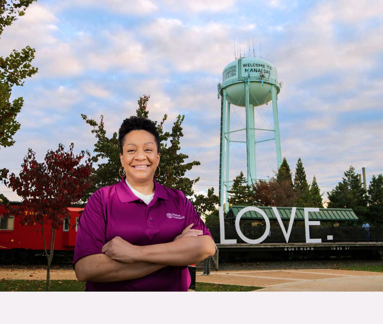 Home Instead caregiver with Manassas, Virginia in the background