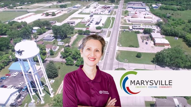 Home Instead caregiver with Marysville Kansas in the background