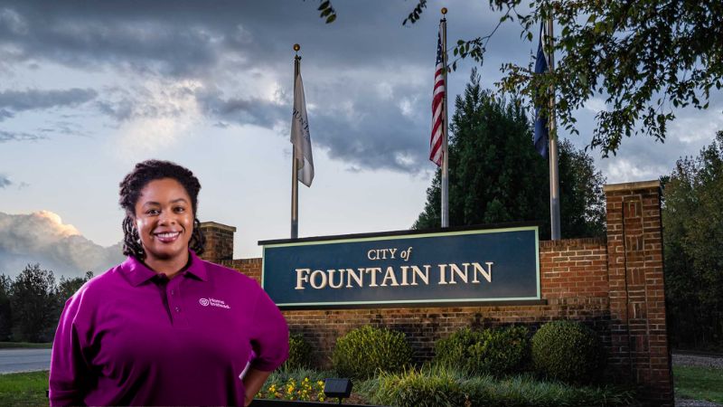 Home Instead caregiver with Fountain Inn South Carolina in the background