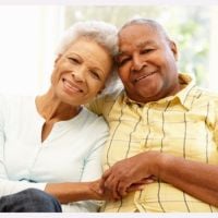 smiling older couple sharing a hug