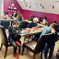 seniors and little kids making valentines day cards