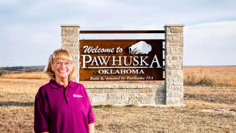 Home Instead caregiver with Pawhuska Oklahoma in the background