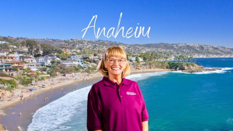 Home Instead caregiver with Anaheim, California in the background