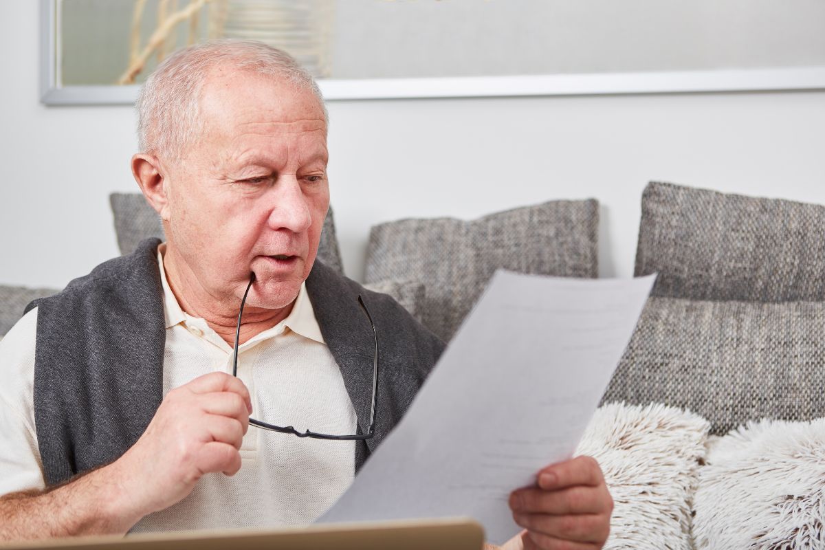 gentleman going over long term care policy paperwork