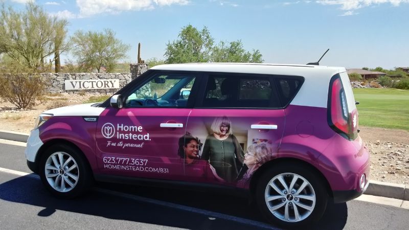 Home Instead car with Victory at Verrado, Buckeye, AZ in the background