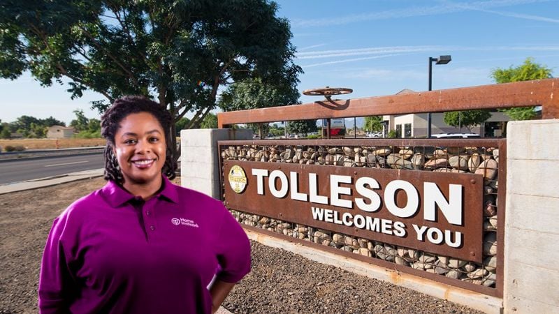 Home Instead caregiver with Tolleson, Arizona in the background