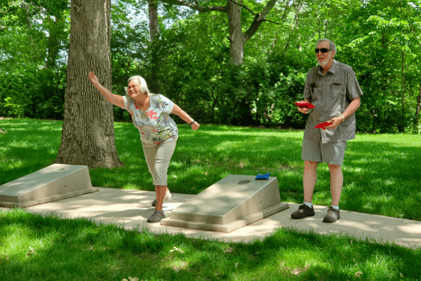 2 Seniors playing cornhole