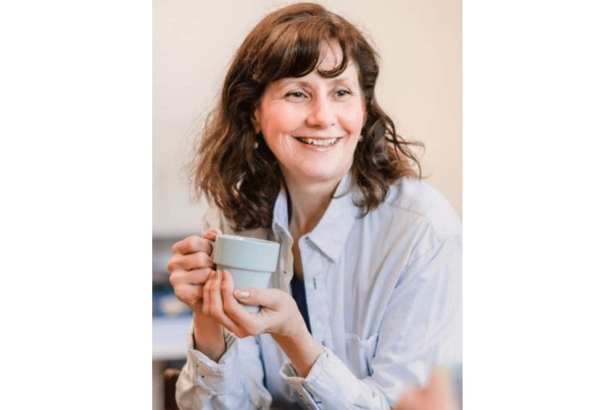 woman holding a coffee cup