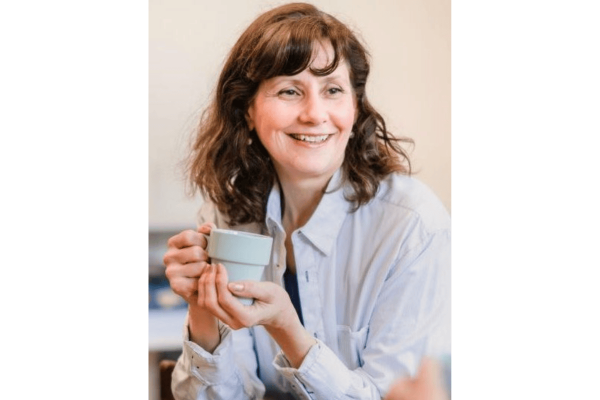 woman holding a coffee cup