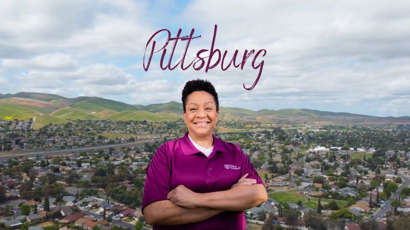 Home Instead caregiver with Pittsburg California in the background