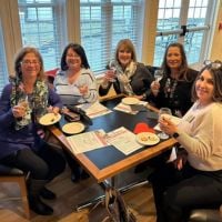 ladies having glass of wine at networking event