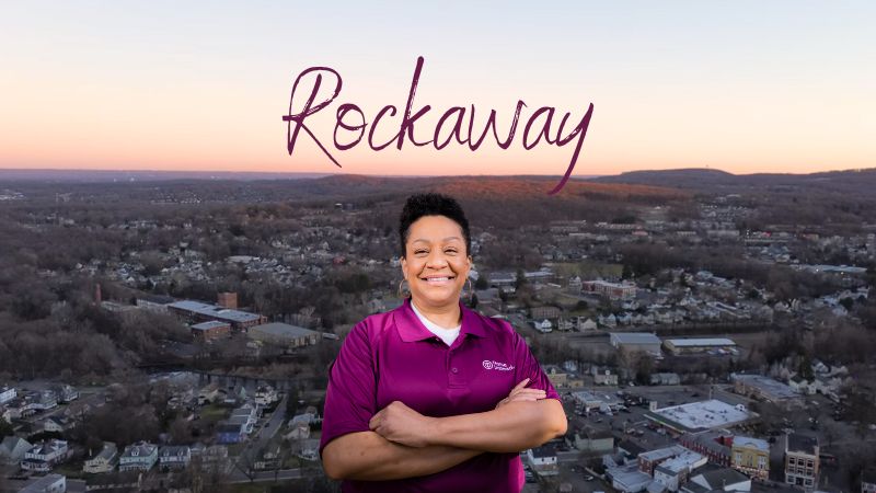 Home Instead caregiver with Rockaway, New Jersey in the background