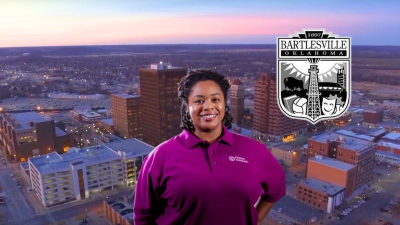 Home Instead caregiver with Bartlesville Oklahoma in the background