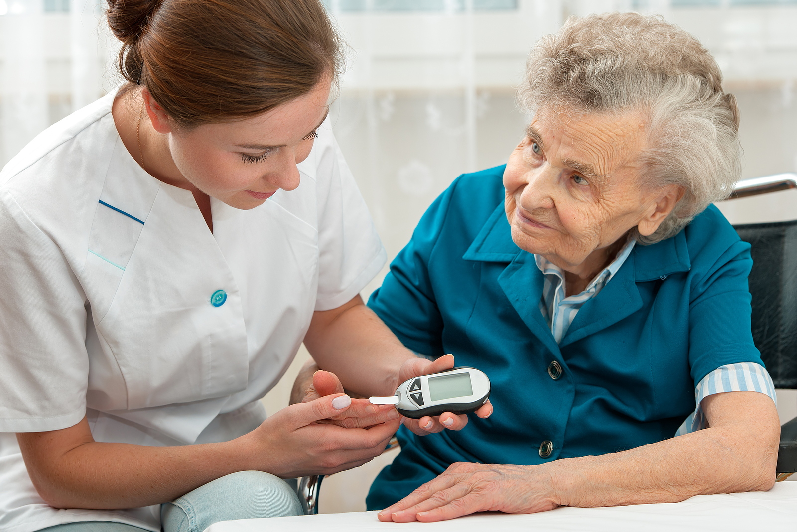 bigstock Female nurse measuring blood g 74599126