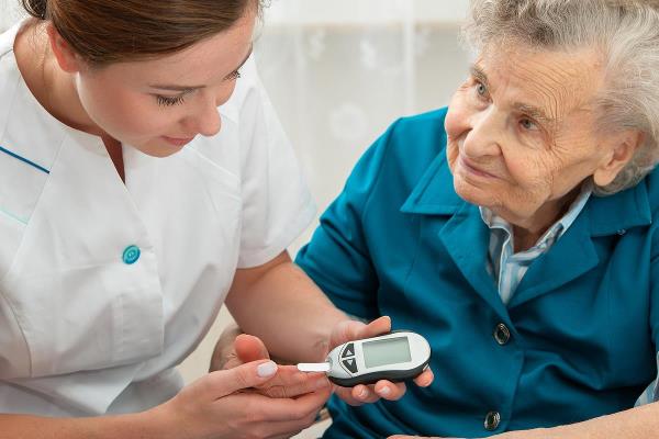 bigstock Female nurse measuring blood g 74599126