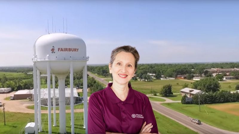 Home Instead caregiver with Fairbury Nebraska in the background