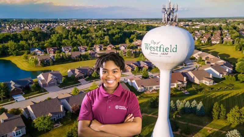 Home Instead caregiver with Westfield Indiana in the background