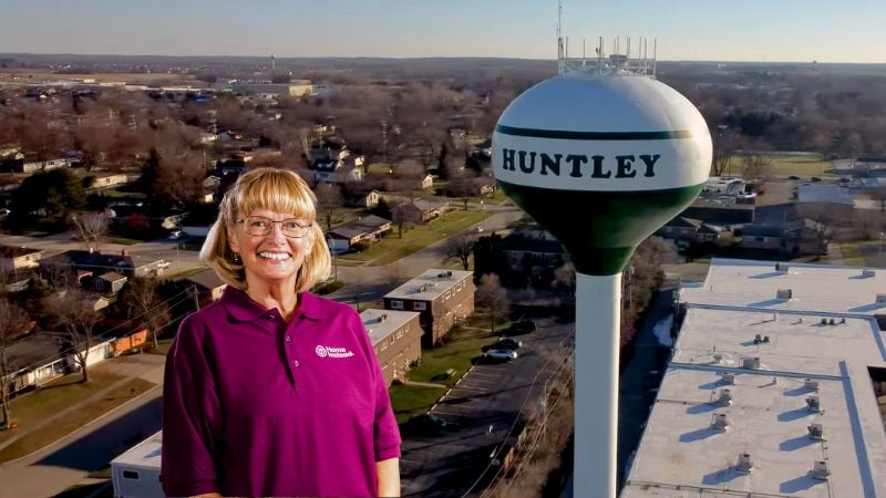 Home Instead caregiver with Huntley, Illinois in the background