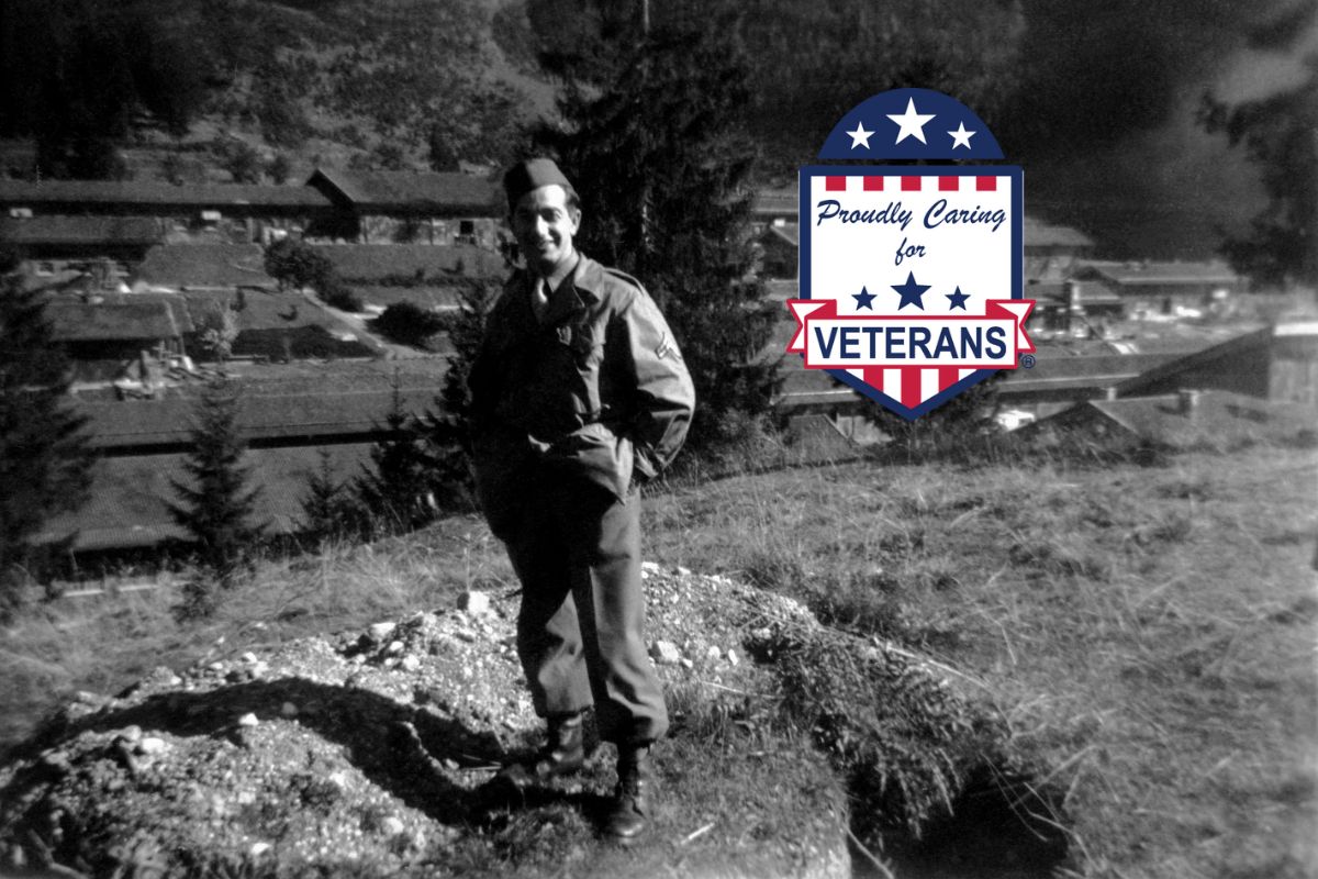 black and white photo with veteran standing on the lands