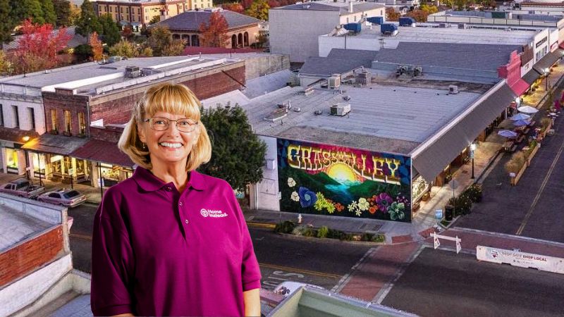 Home Instead caregiver with Grass Valley California in the background