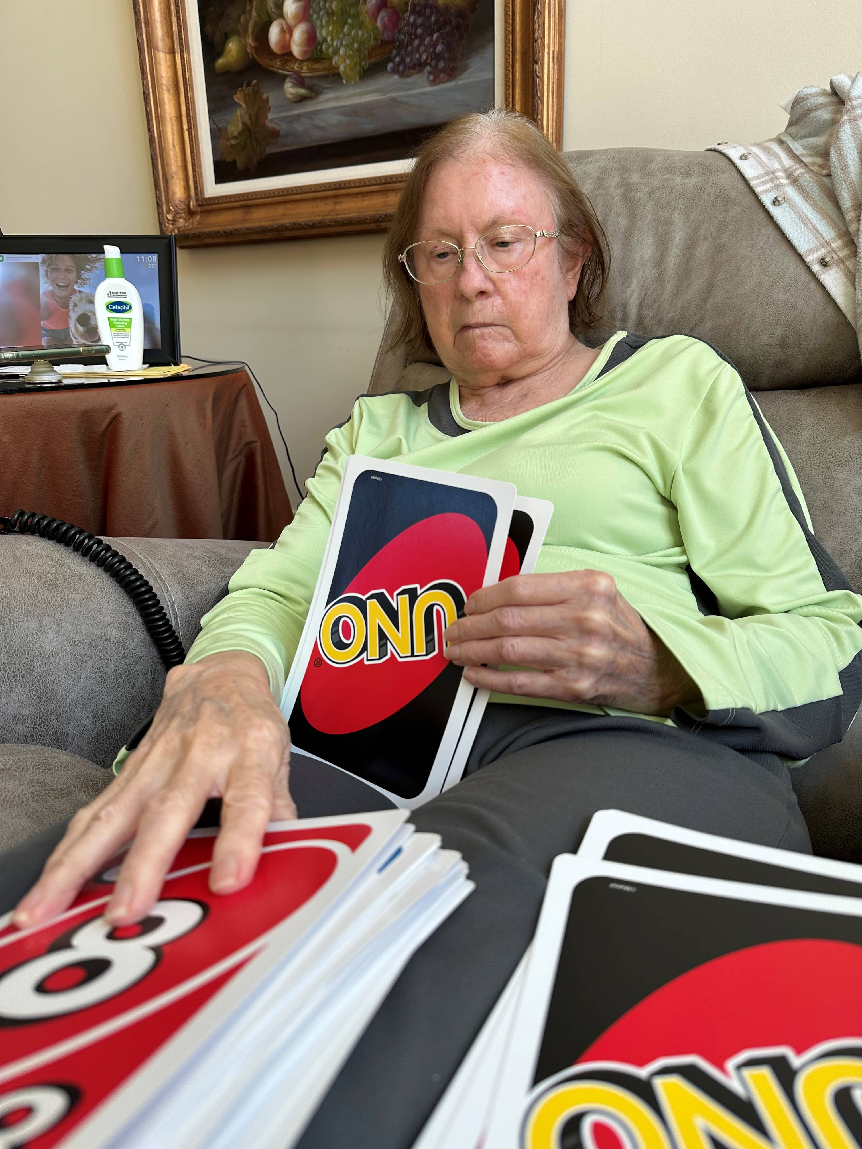 Home Instead Care Pro Erin playing Uno with Elder Care Client Mrs R 1 