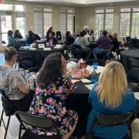 attendees of the social worker appreciation day sitting at table