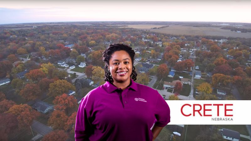 Home Instead caregiver with Crete Nebraska in the background