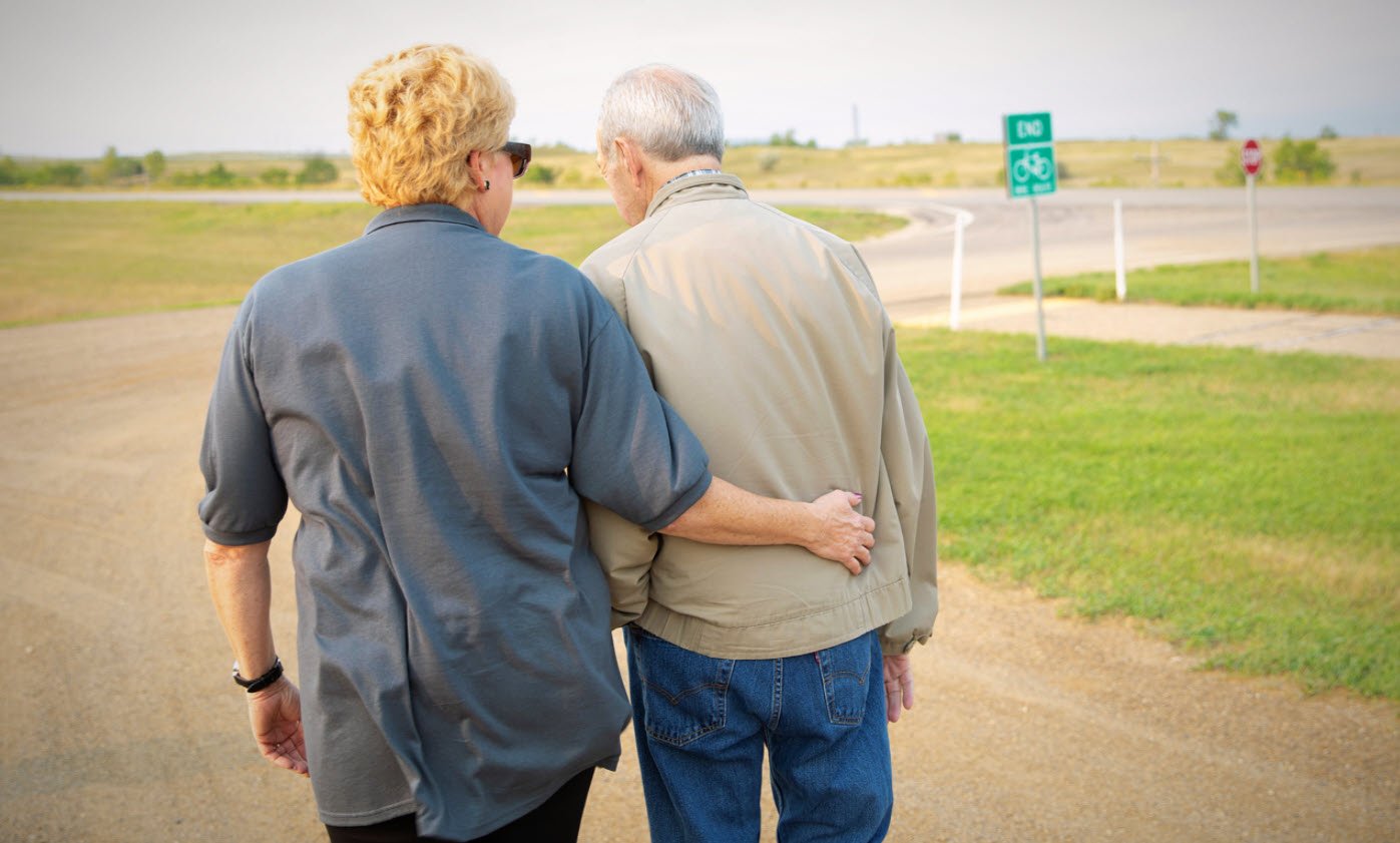 Seniors walking on a road