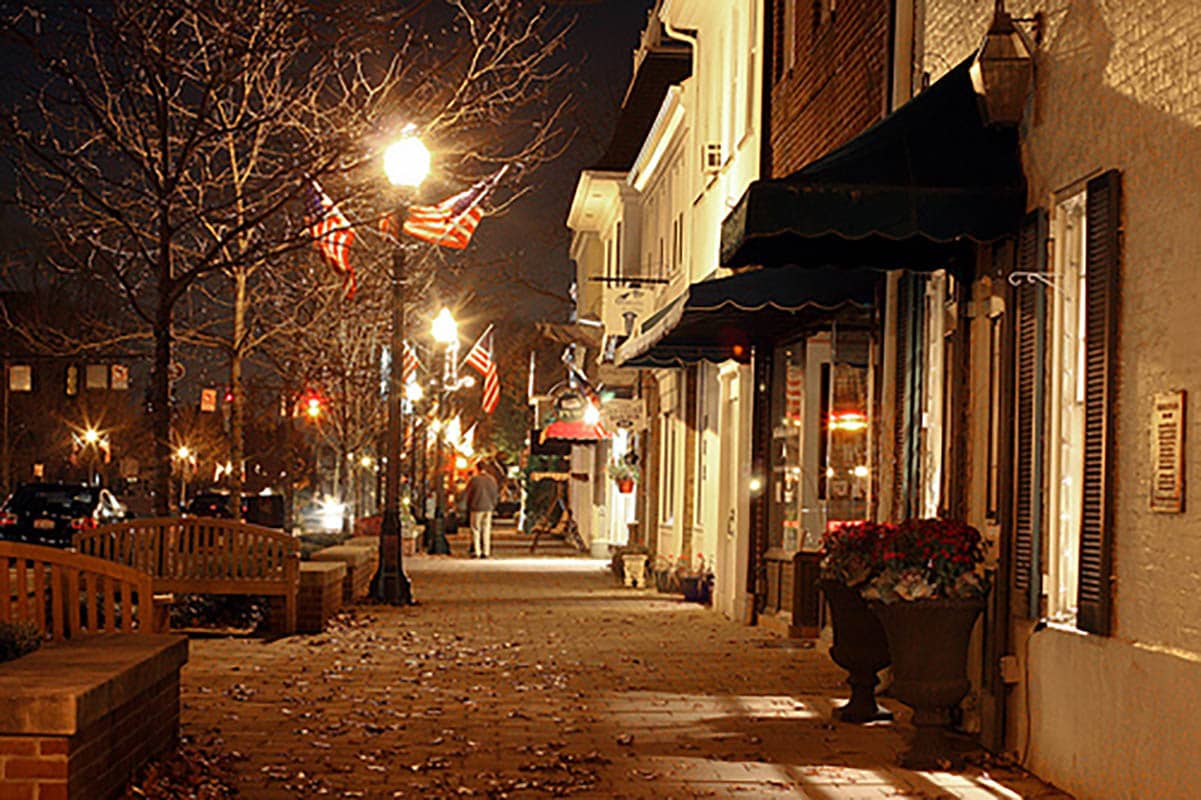 Photo of sidewalk in Old Worthington on a fall night. Great for a peaceful walk for your senior loved one and their CAREGiver