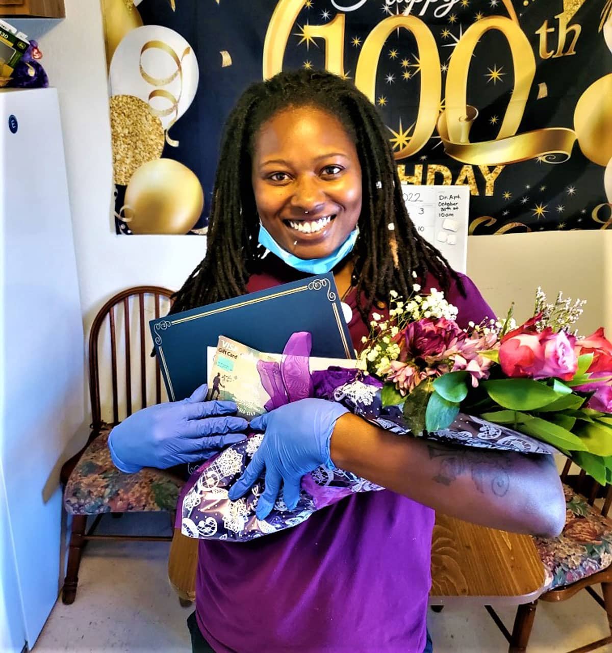 Shelia Graves, holding balloons and flowers is our Care Professional of the 2nd Quarter of 2022.