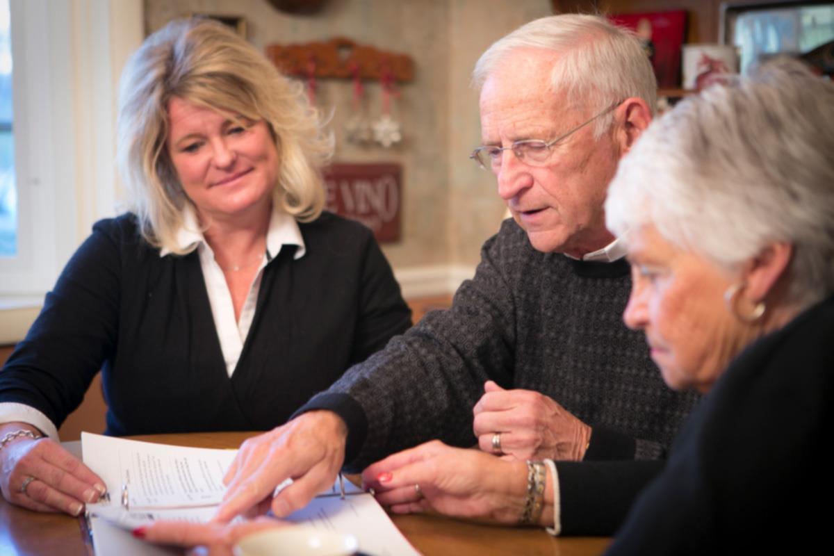 Family gathered looking at documents