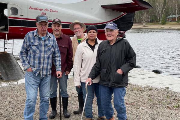 Caregiver assists 97 year old client on Canada fishing trip hero