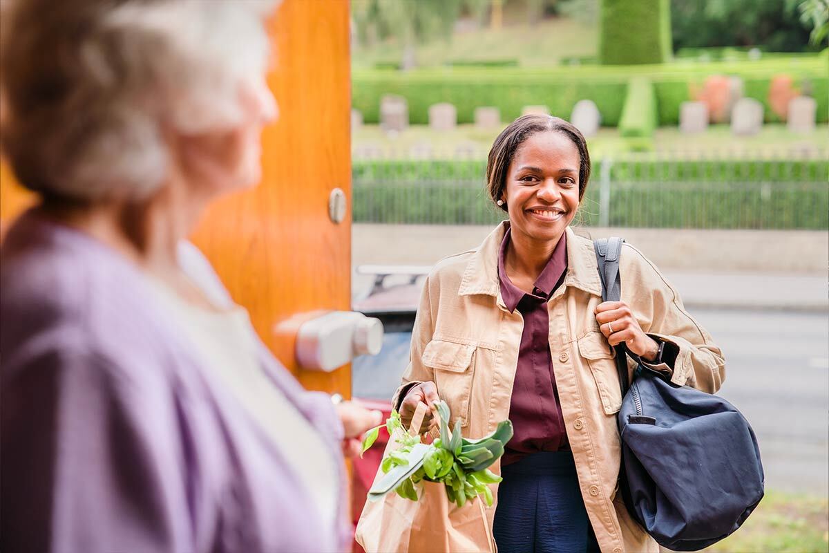 Woman visits senior woman 1 