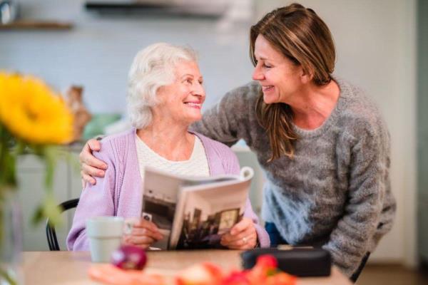 senior woman reads magazine caregiver2