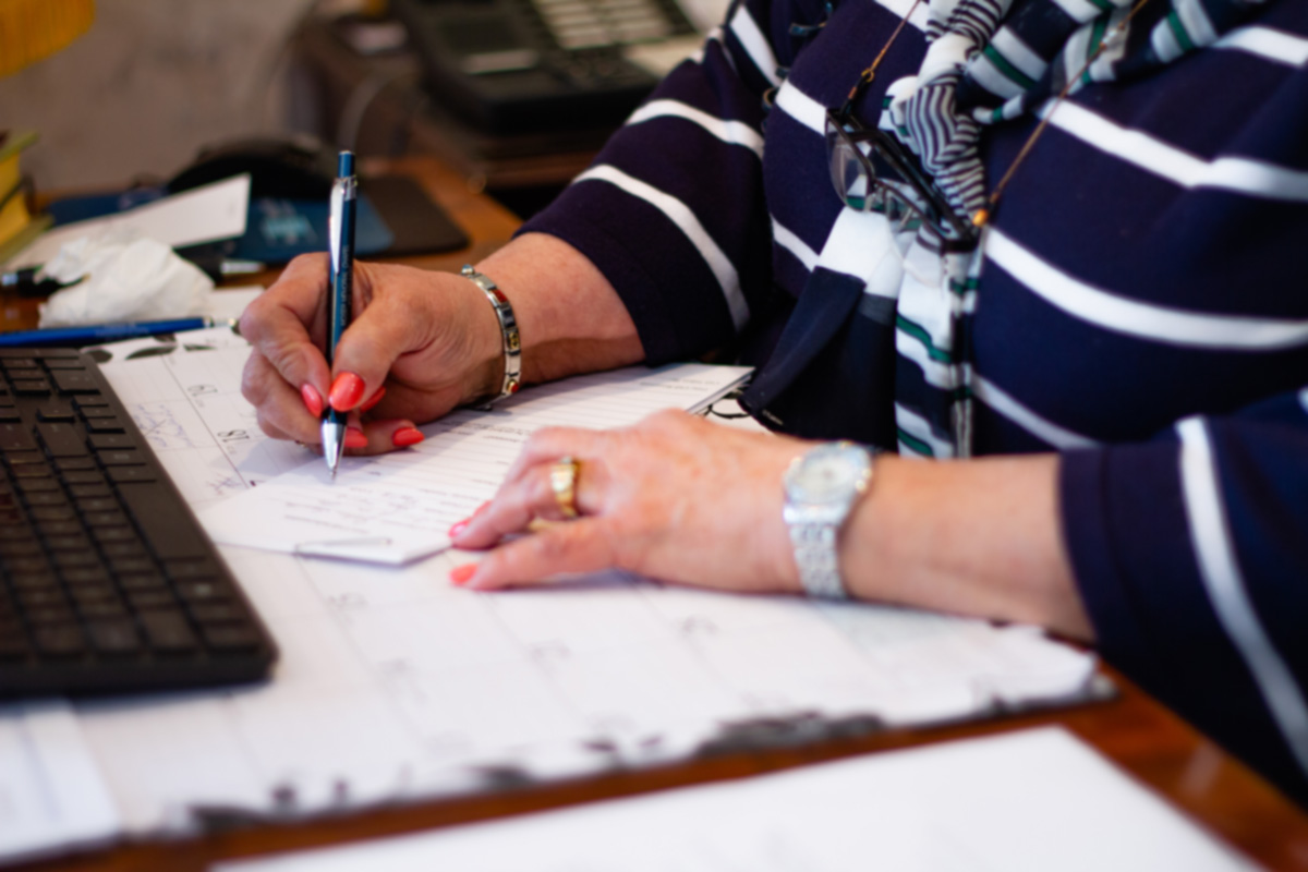 Retiree paying bills and organizing paperwork